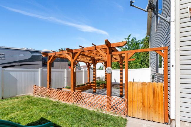 Fenced backyard featuring a pergola | Image 26