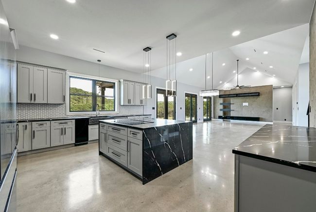 State of the art appliances also include Samsun Bespoke double ovens with pro cooking camera, Samsumng Bespoke 4 French door fridge, Cafe drawer microwave, and Cafe drawer dishwasher. | Image 17