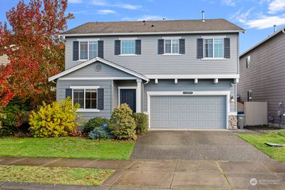 This stylishly updated craftsman is move-in ready, offering peaceful living on a quiet cul-de-sac near Martha Lake! | Image 1