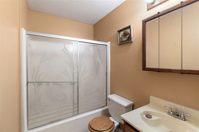 Full bathroom with vanity and enclosed tub / shower combo | Image 23
