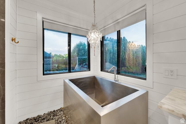 Bathroom with healthy amount of natural light, a chandelier, and ornamental molding | Image 20