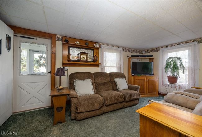 Living room featuring carpet flooring | Image 11