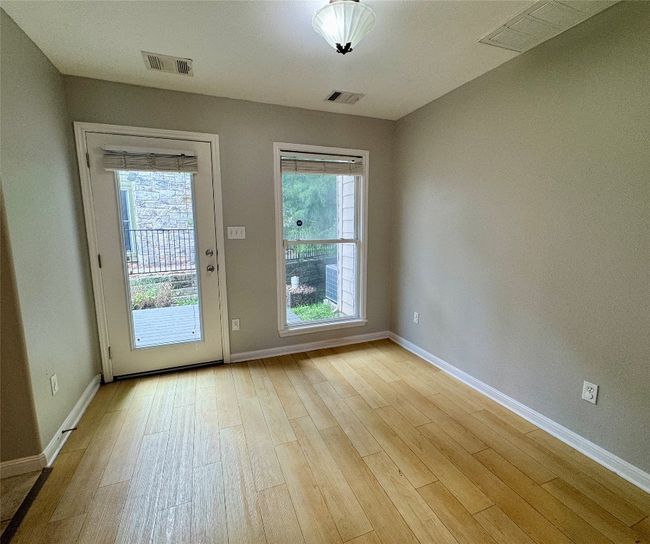 Doorway to outside featuring baseboards and light wood finished floors | Image 6