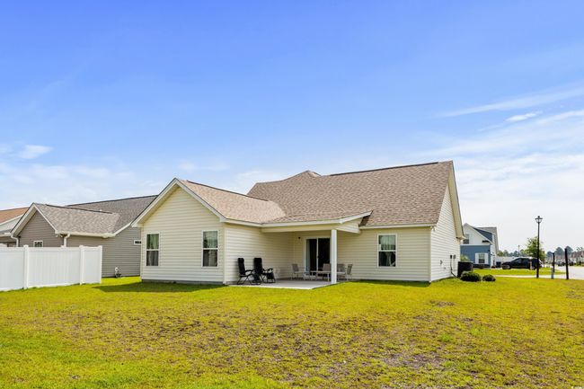 Back of property featuring a patio area, roof with shingles, and cooling unit | Image 24
