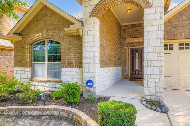 Property entrance with brick siding and stone siding | Image 4