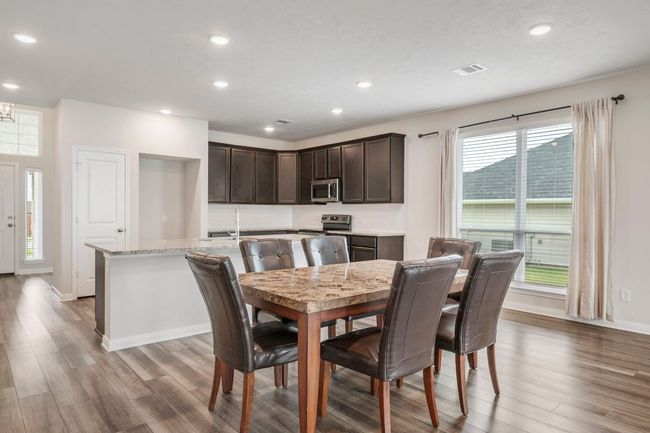 Dining area with recessed lighting and light wood-style floors | Image 9