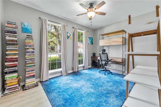 The second bedroom is located at the front of the home and could be utilized as a home office. | Image 18