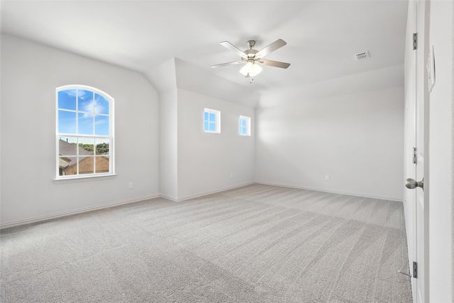 Unfurnished room featuring healthy amount of natural light, light colored carpet, and a ceiling fan | Image 27