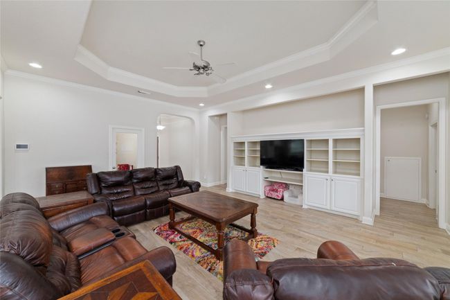 Nice-sized living room with built-ins. | Image 12