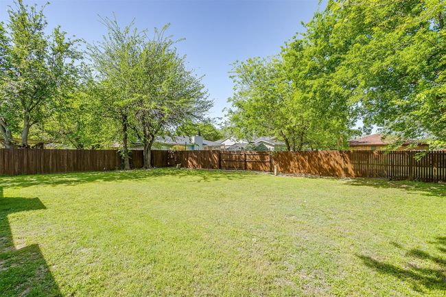 View of fenced backyard | Image 27