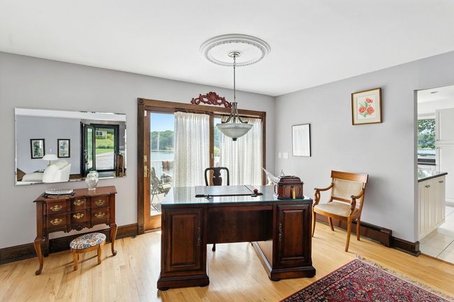 Home office featuring a baseboard heating unit and light wood-type flooring | Image 18