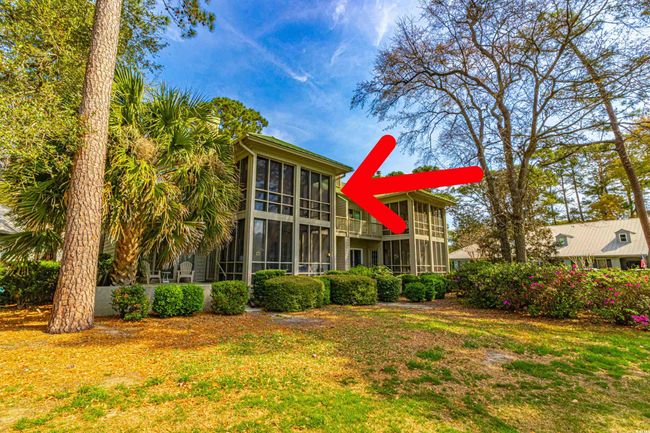 Back of property featuring a sunroom and a yard | Image 34