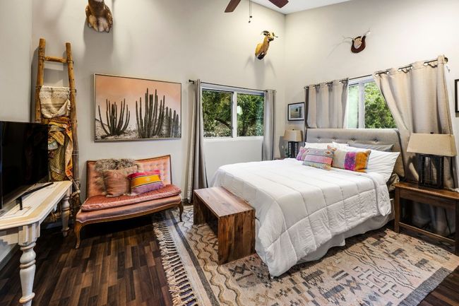 Vaulted ceiling private bedroom with attached full bathroom | Image 39