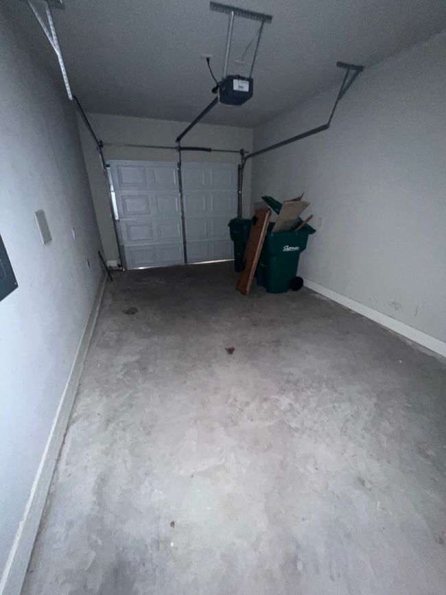 Garage featuring a garage door opener | Image 17