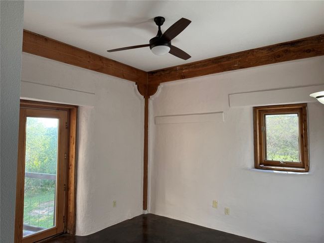 Guest Bedroom featuring a ceiling fan | Image 36