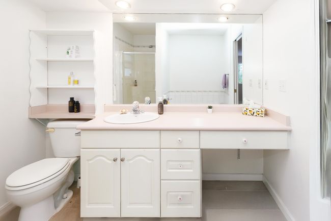 Full bathroom with toilet, a stall shower, vanity, and tile patterned floors | Image 22
