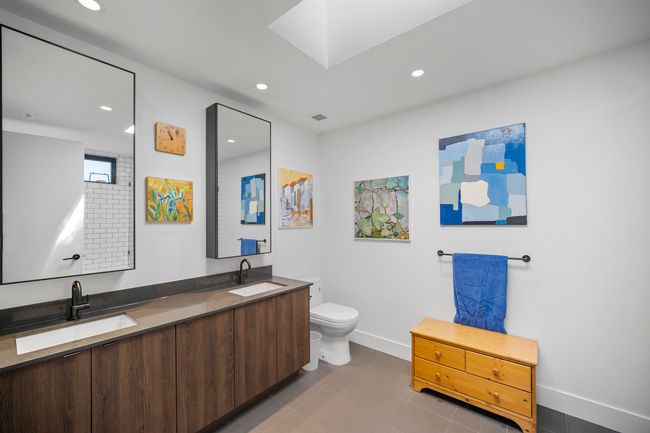 Bathroom with double vanity, recessed lighting, and tile patterned floors | Image 15