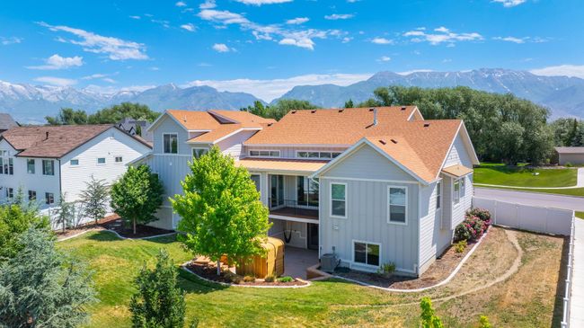 Back of house featuring board and batten siding, a mountain view, and a fenced backyard | Image 33