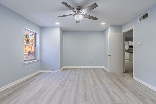 Unfurnished room with light hardwood / wood-style floors and ceiling fan | Image 30