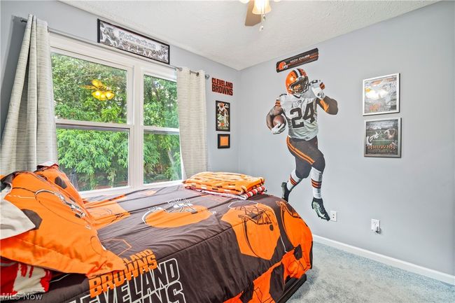 Carpeted bedroom featuring a textured ceiling and ceiling fan | Image 27