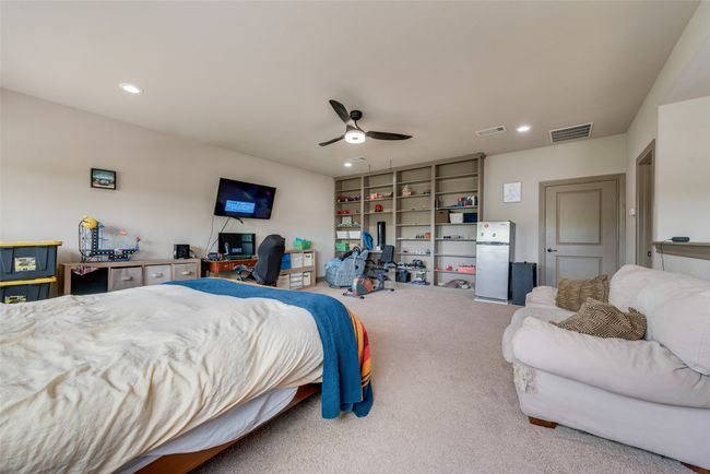 Bedroom with carpet floors, a desk, ceiling fan, and recessed lighting | Image 31