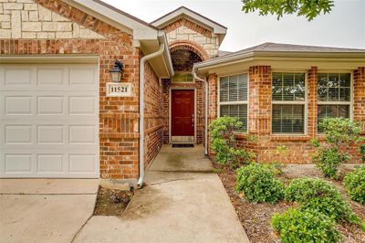 Entrance to property featuring a garage | Image 1