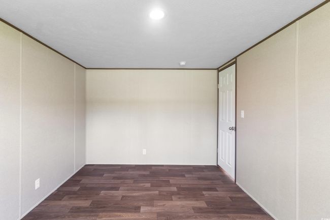 Spare room featuring wood finished floors and recessed lighting | Image 36