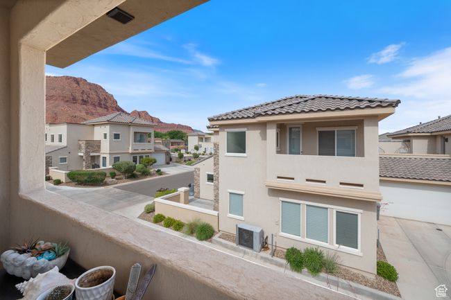 Primary bedroom balcony with a residential view and a mountain view | Image 19