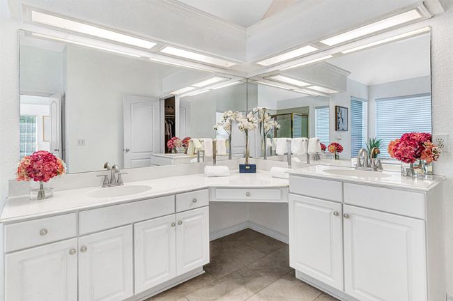 clean primary bathroom with double vanities | Image 22