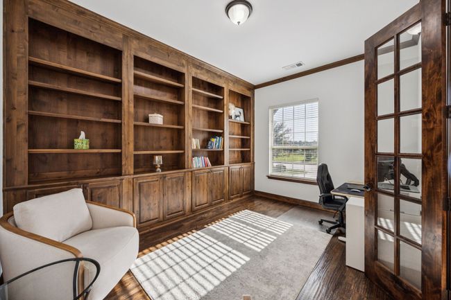 Home office featuring ornamental molding and dark wood-style floors | Image 5