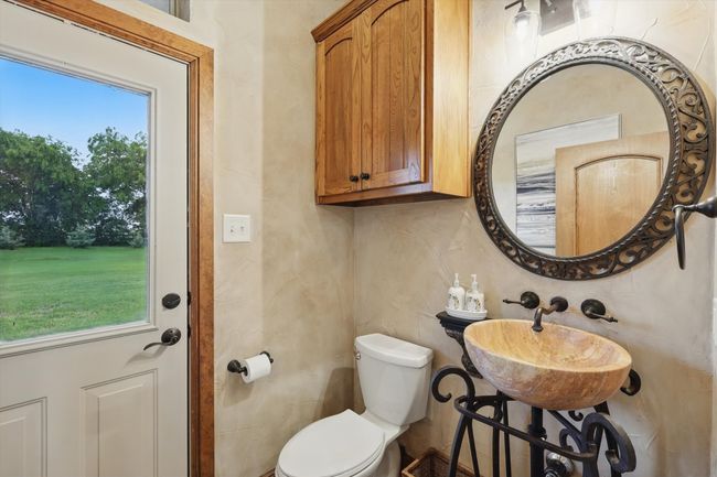 Bathroom with toilet and a sink | Image 17