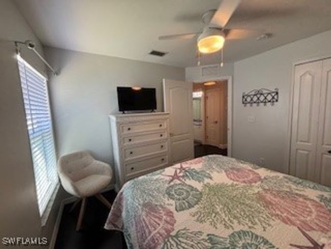 Bedroom featuring a closet and ceiling fan | Image 20
