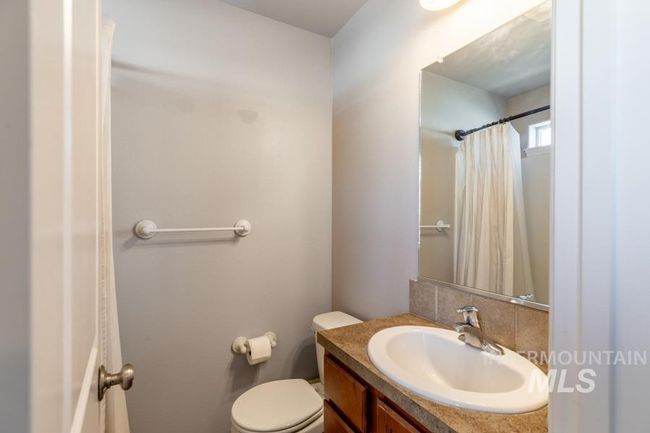 Full bathroom with vanity and curtained shower | Image 15