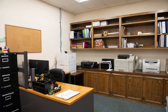 Office with a paneled ceiling | Image 14