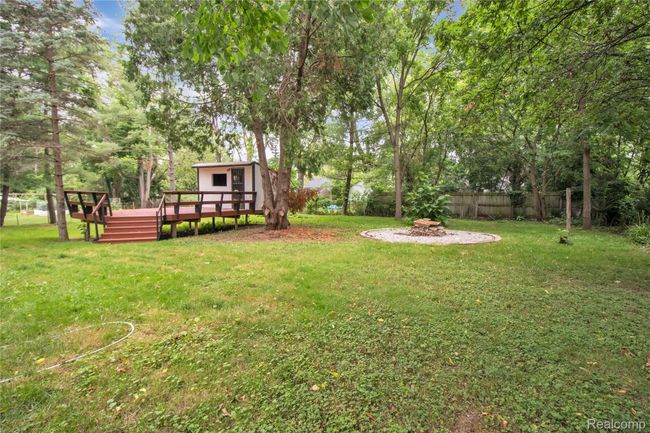 Huge back yard with fire pit | Image 24