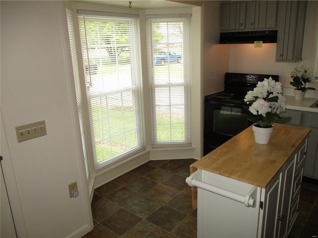 Kitchen Boasts Plenty of Light Grey Cabinetry | Image 9