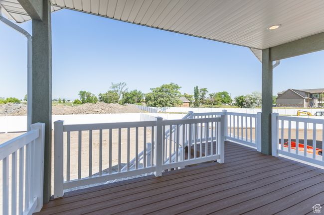 Wooden terrace with a fenced backyard | Image 7