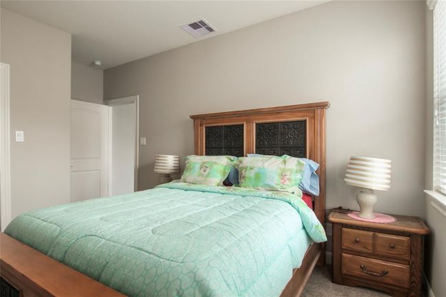 Oversized bedroom located upstairs offers ample space for a queen size bed. | Image 39