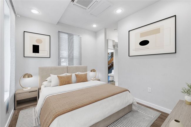 Bedroom featuring wood finished floors and recessed lighting | Image 26