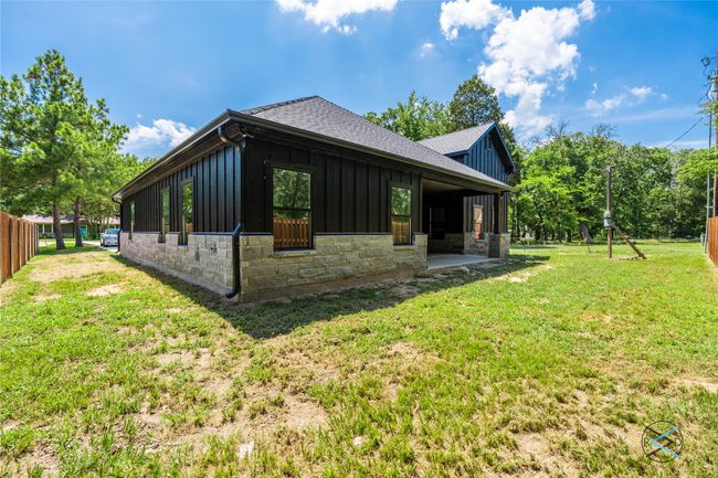 View of home's exterior featuring a lawn | Image 22