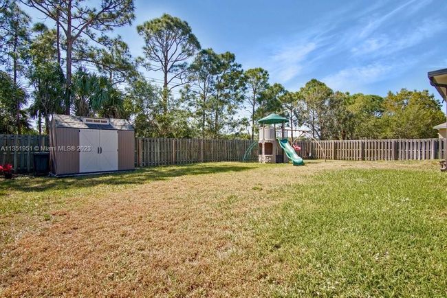 5806 Nw Breezy Brook Ct, House other with 3 bedrooms, 2 bathrooms and null parking in Port St. Lucie FL | Image 33