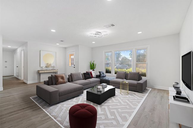 Living room with light hardwood / wood-style floors | Image 14