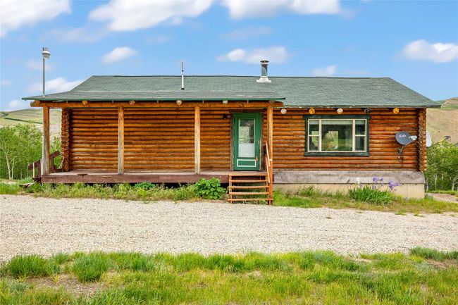 Log-style house featuring log exterior | Image 4