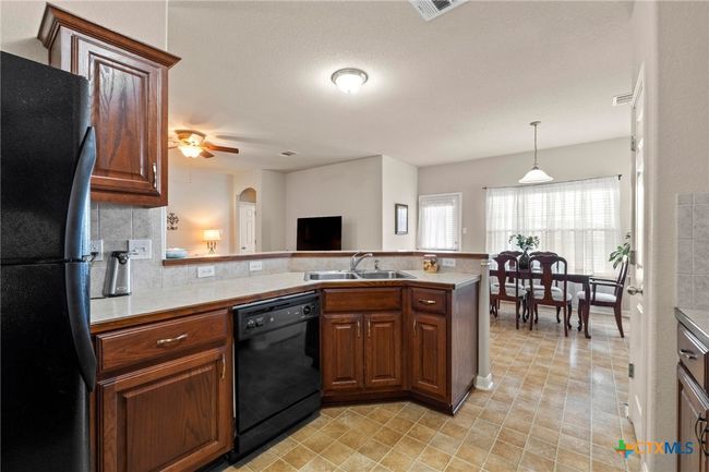kitchen open to dining | Image 12