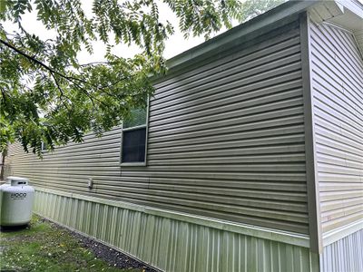 rear backs up to tree line and a private deck | Image 3