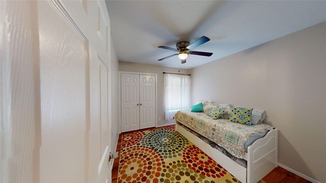 Bedroom featuring baseboards, a closet, and a ceiling fan | Image 9