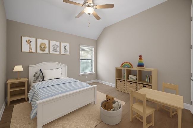 Bedroom featuring wood finished floors, vaulted ceiling, and a ceiling fan | Image 25