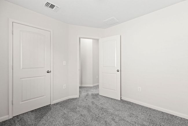 Unfurnished bedroom with carpet flooring and baseboards | Image 16
