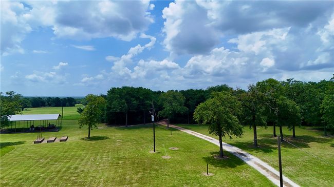 View of community featuring a lawn | Image 8