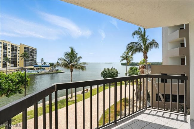 Balcony featuring a water view | Image 34